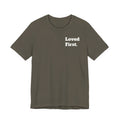 "Loved First." Minimalist Inspirational Tee