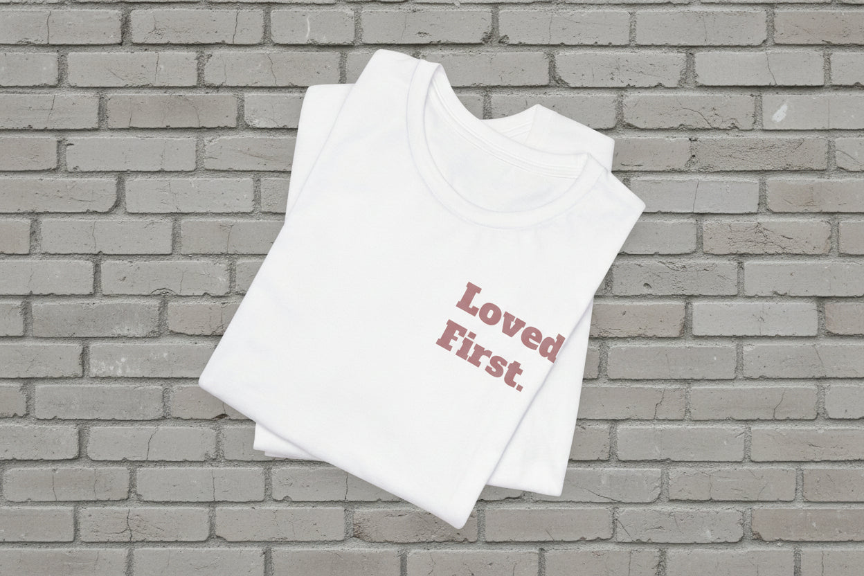 "Loved First." Minimalist Inspirational Tee